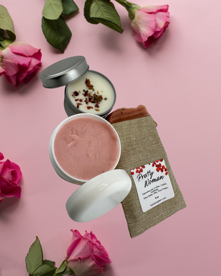 "Mother’s Day Collection by Sebi’s Daughters displayed on a soft pink rose background—featuring rose candle, Pretty Woman Rose Soap, and Rose Body Butter"