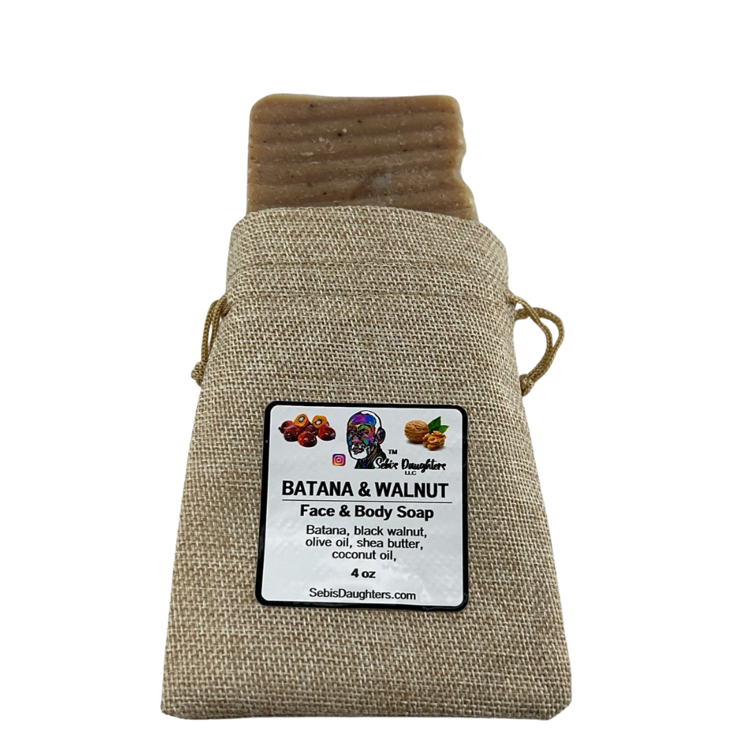 Image of the 4oz Batana and Walnut Soap in burlap packaging with the Sebis Daughters Product Label.