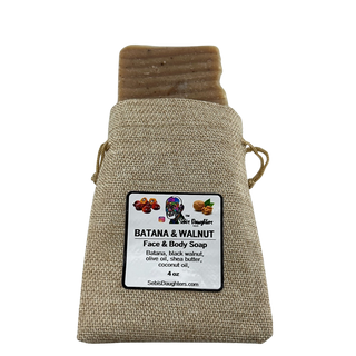 Image of the 4oz Batana and Walnut Soap in burlap packaging with the Sebis Daughters Product Label.