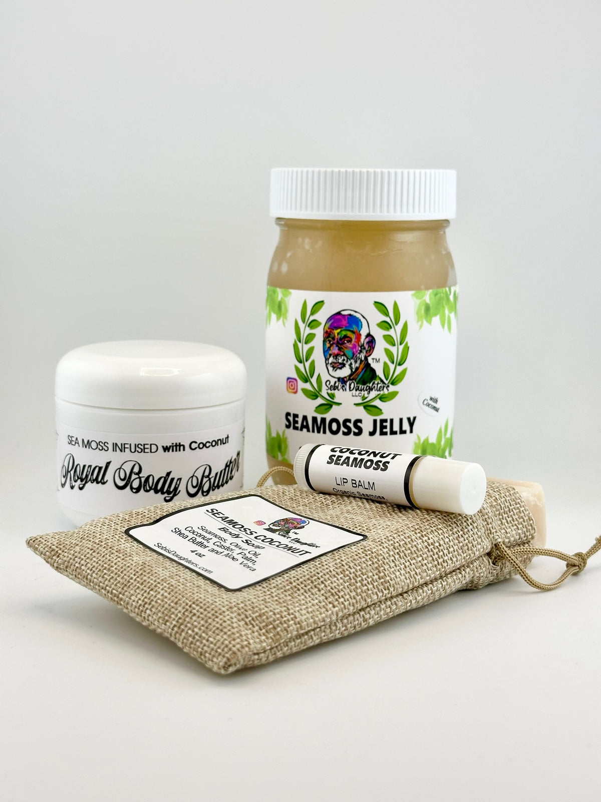 Coconut Sea Moss Bundle featuring a jar of Coconut sea moss jelly, a jar of royal body butter with Coconut, a Coconut lip balm and a burlap drawstring pouch with Coconut Seamoss Soap.