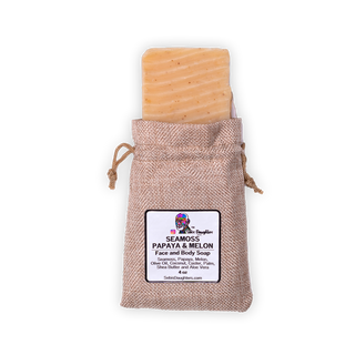 Image of Sebi's Daughters Seamoss Papaya and Melon Soap with a natural light yellow color and enclosed in a burlap sack that closes with drawstrings on each side.