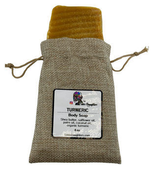 Sebi’s Daughters Organic Turmeric Soap bar on a white background, showcasing its natural golden color and smooth texture, made with shea butter, coconut oil, and organic turmeric for an alkaline lifestyle.