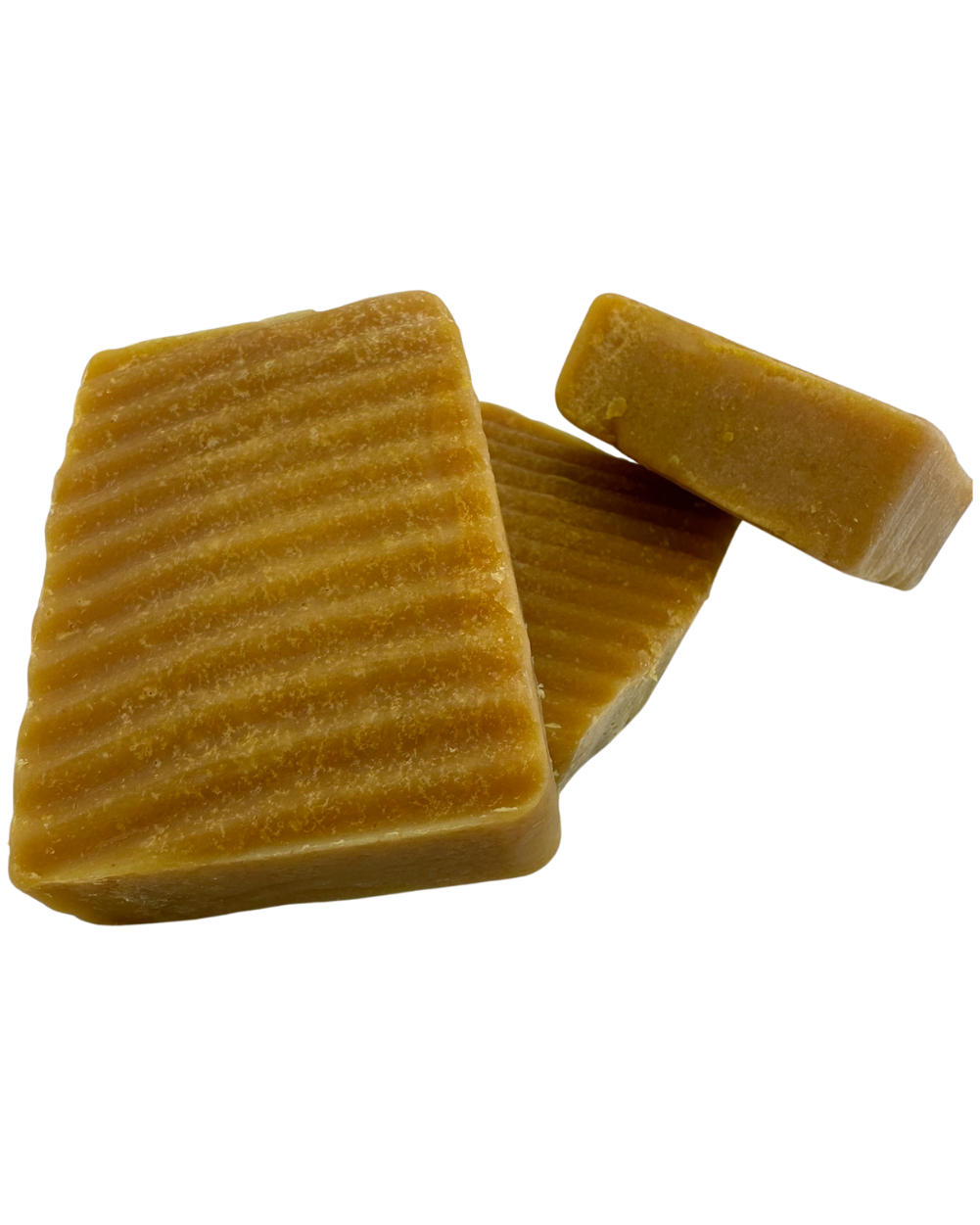 Three (3) Sebi’s Daughters Organic Turmeric Soap bar on a clear background, showcasing its natural golden color and smooth texture, made with shea butter, coconut oil, and organic turmeric for an alkaline lifestyle.